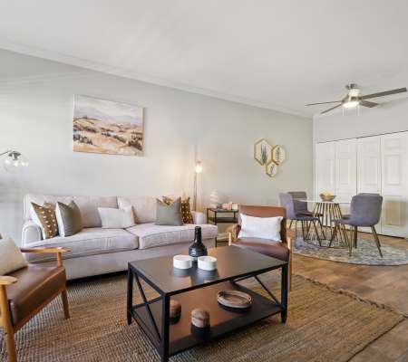 Luxury living room with plush carpeting at Paloma Summit Condominium Rentals in Foothill Ranch, California
