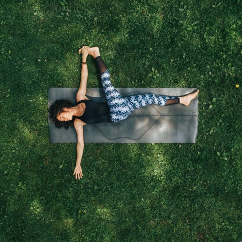 Woman on a yoga mat at Woodstream Townhomes in Rocklin, California
