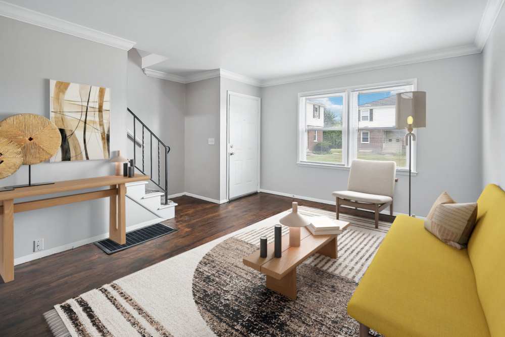 Living room with sophisticated furniture at Eden Green Townhomes in Columbus, Ohio