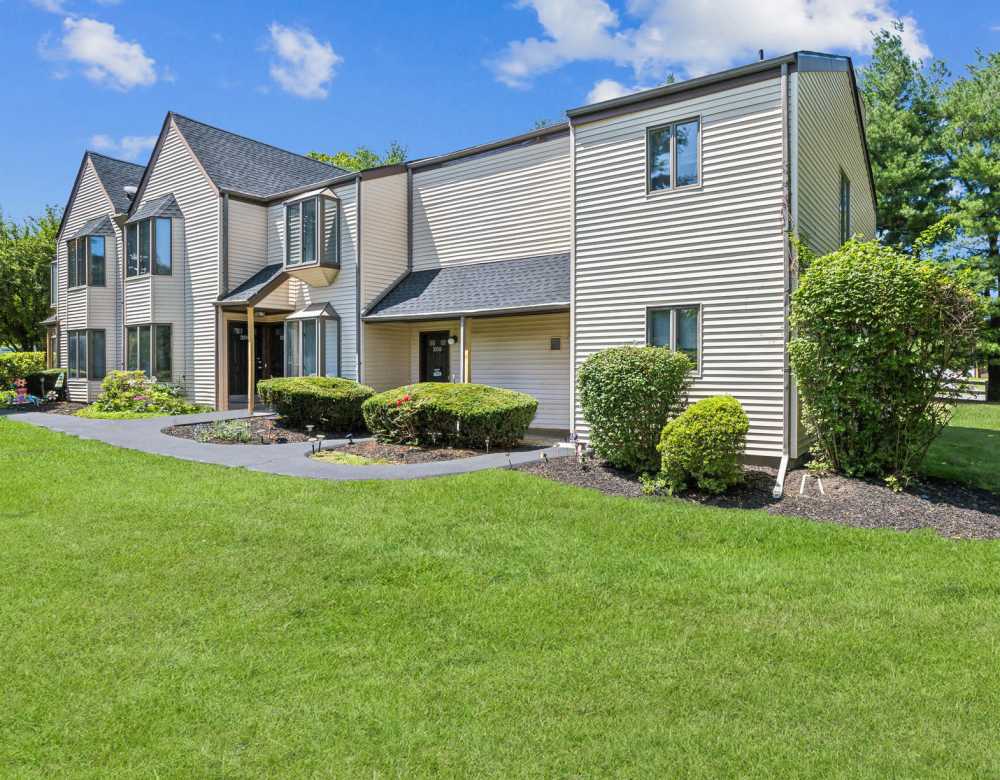 Outdoor Apartment View with Green Landscaping at Eagle Rock Apartments at Mohegan Lake in Mohegan Lake, New York