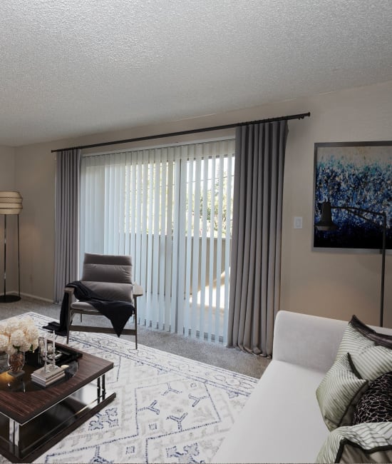 Spacious living room at Arden Palms Apartments in Sacramento, California