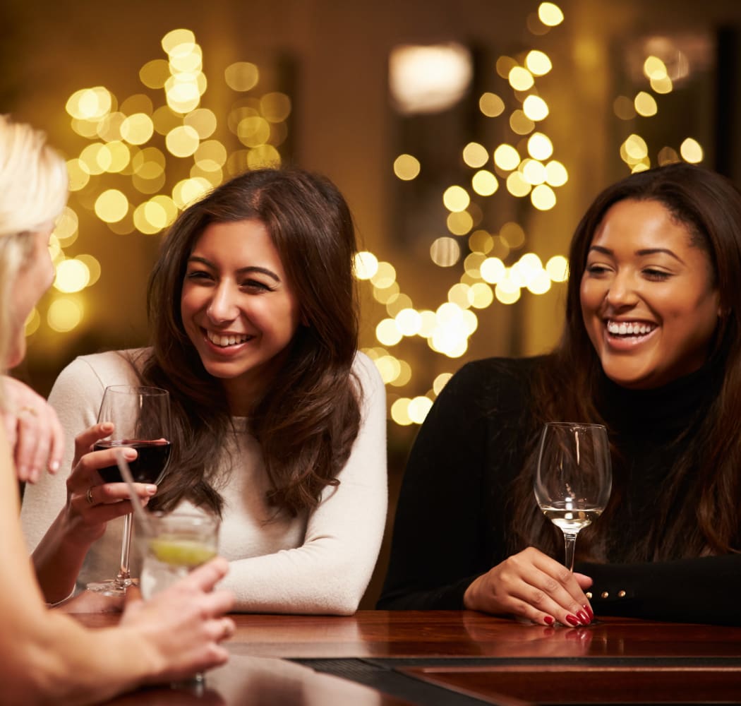 Residents enjoying drinks near Abbey at Vista Ridge Apartments in Lewisville, Texas