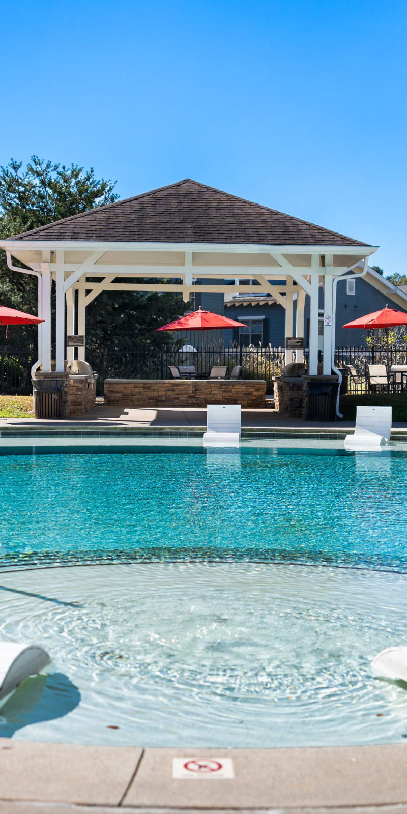Resort-style swimming pool and lounge chairs at West 22 in Kennesaw, Georgia