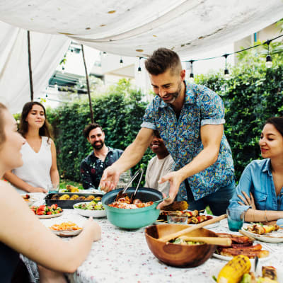 Residents enjoying a meal at a party at Reagan Park in Lemoore, California