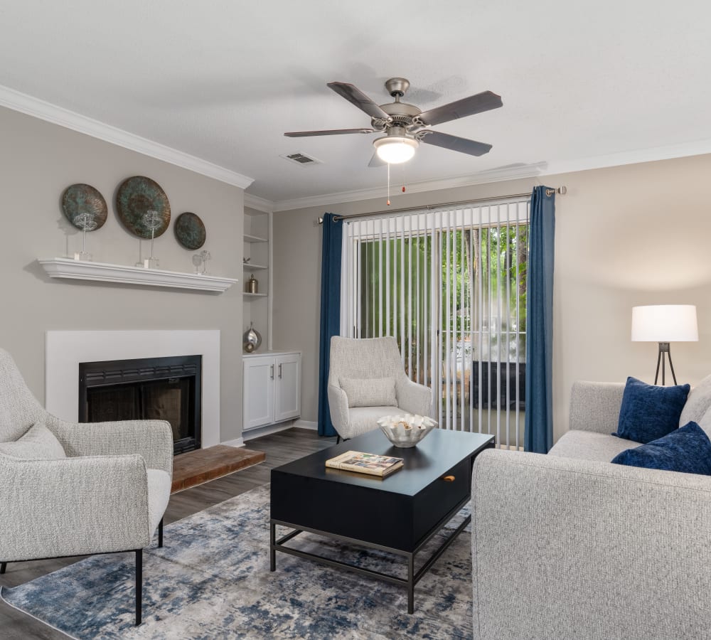 A spacious apartment living room with hard-wood flooring at Lenox Gates in Mobile, Alabama