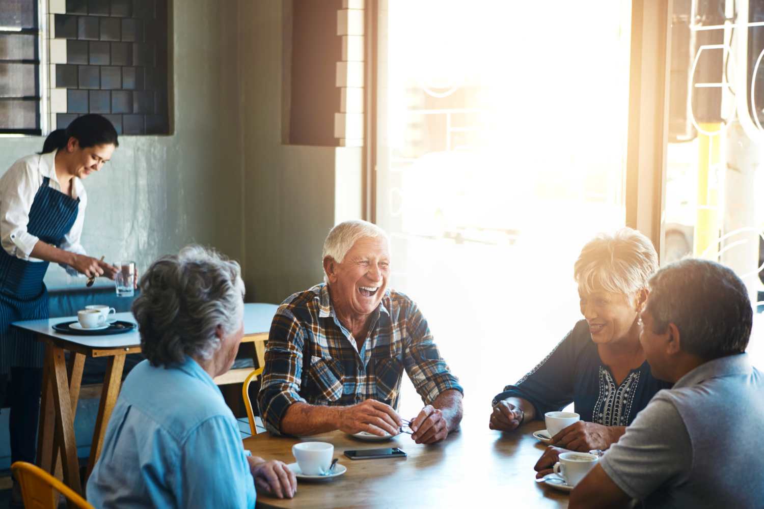 Residents enjoying their coffee near Willow Creek Apartments in Escanaba, Michigan
