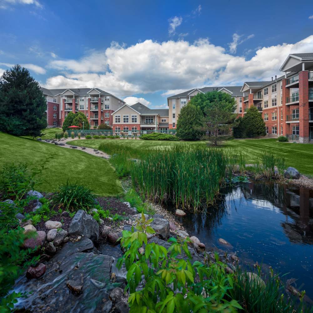 Exterior view of the building and greenery all around at LeSilve in Middleton, Wisconsin
