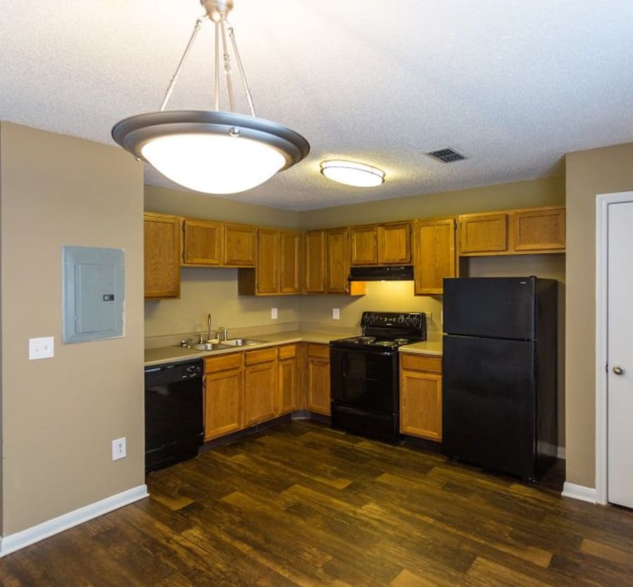 Kitchen with black appliances at Cypress Creek Townhomes in Goodlettsville, Tennessee