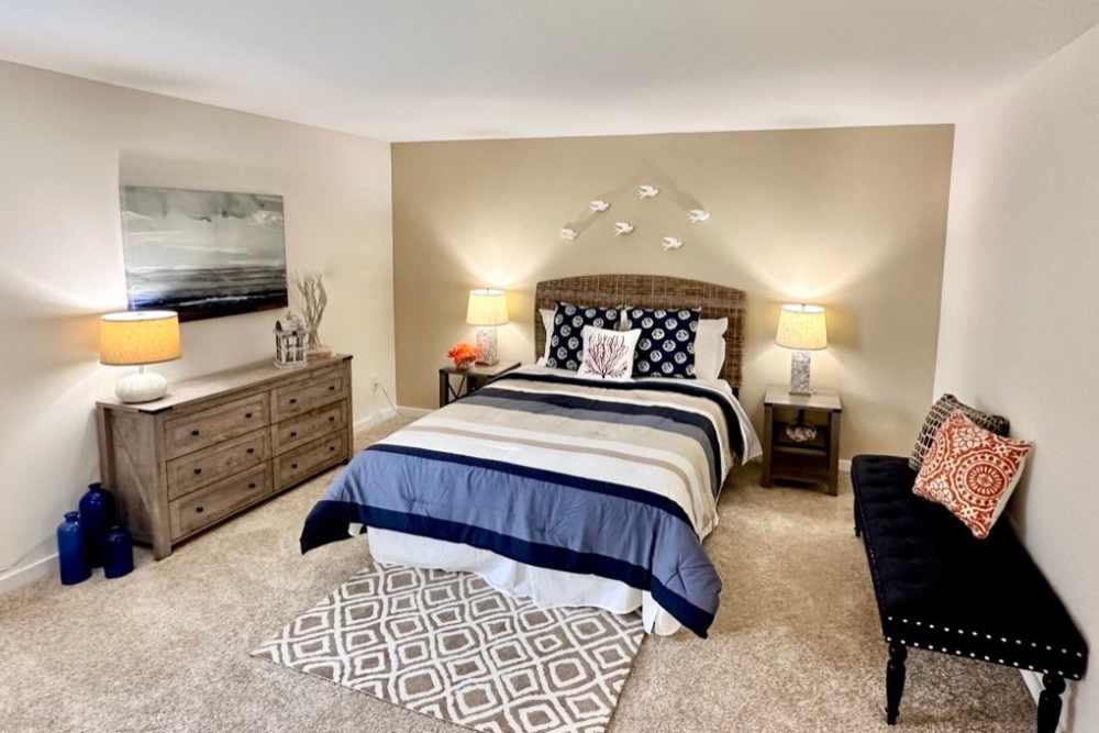 a furnished bedroom at Aspen Apartments in Virginia Beach, Virginia