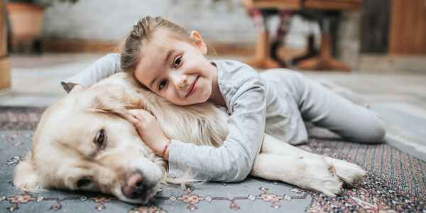 Kid posing with her pet at The Flats Of Donelson in Nashville, Tennessee
