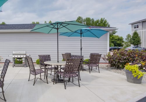 Grilling station and outdoor patio of Villa Capri Apartments in Rochester, New York