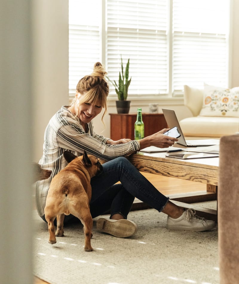 Resident working from home with her dog at Rutledge Flats in Nashville, Tennessee