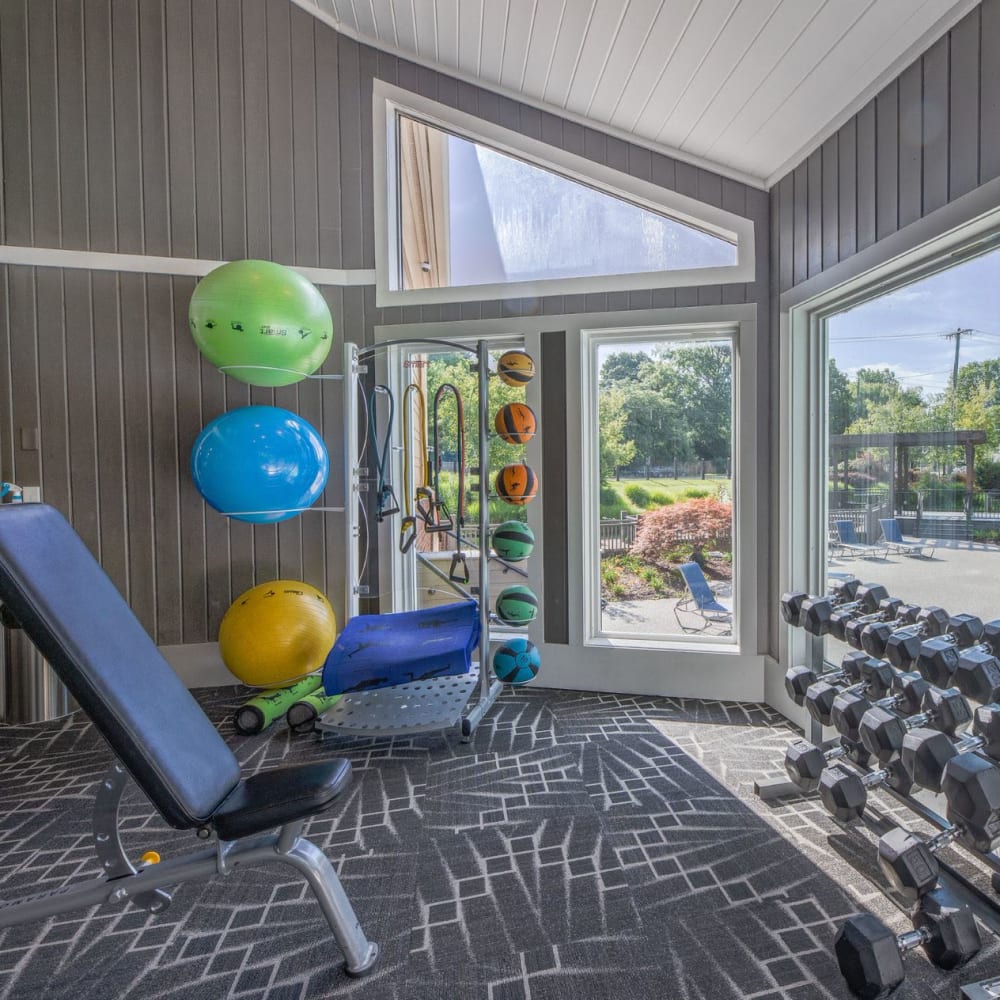  Gym equipment with pool view at Butternut Ridge Apartments in North Olmsted, Ohio