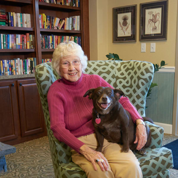 Senior lady sitting with her dog