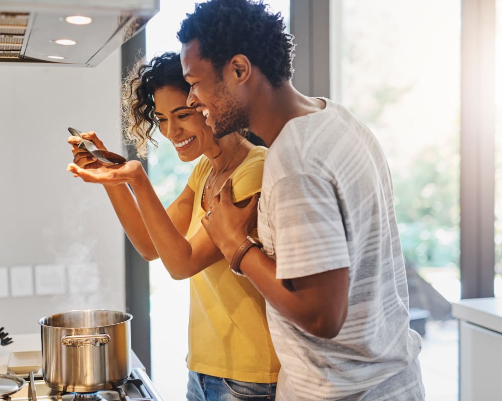 Couple cooking together at Carriage House in Syracuse, New York