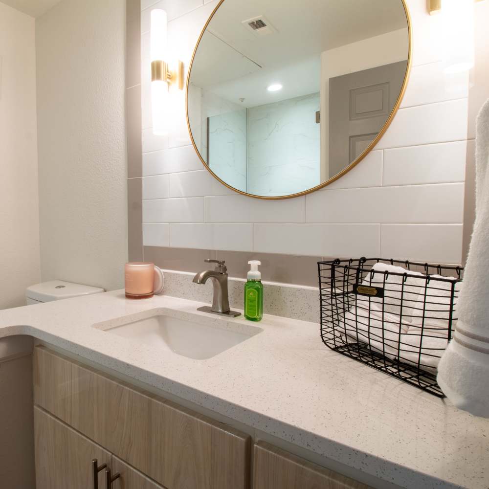 Bathroom vanity with modern fixtures at Sutton in Austin, Texas