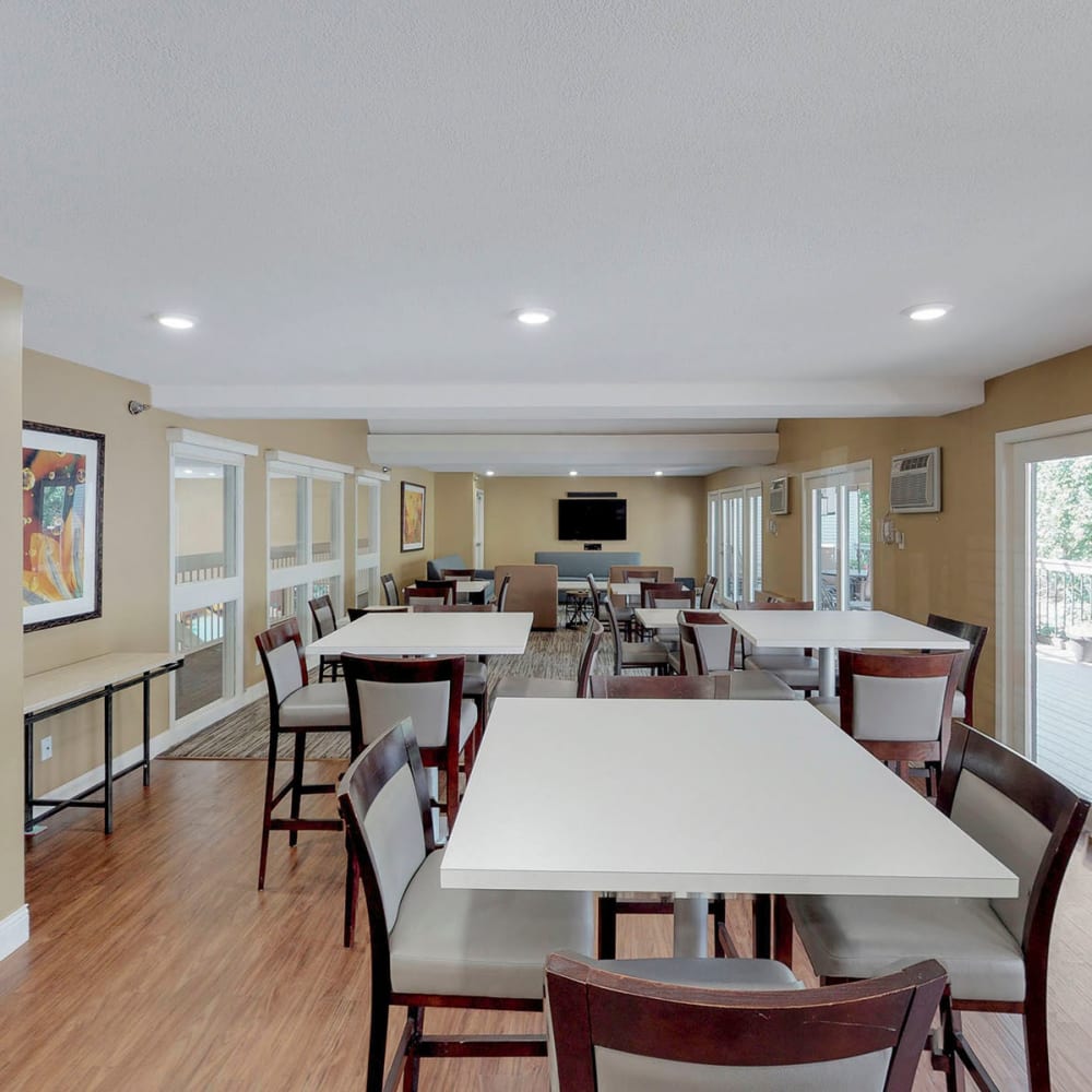 Spacious club room with ample gathering areas in the resident clubhouse at Oaks Vernon in Edina, Minnesota