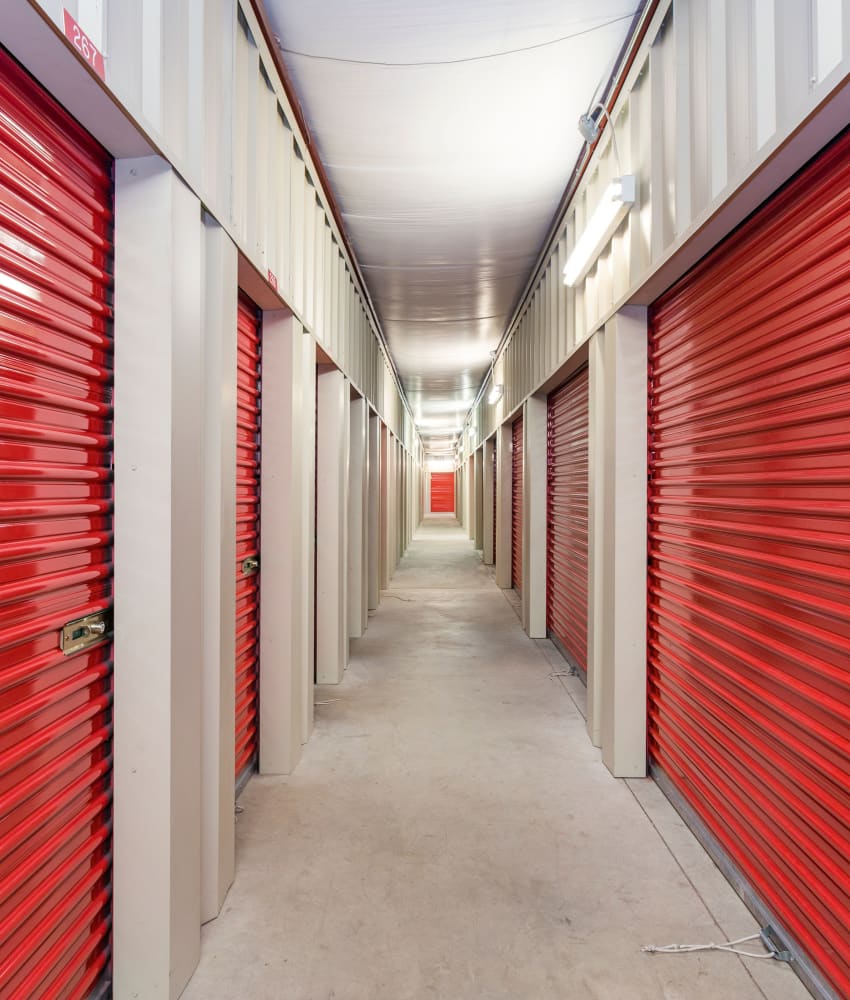 orange doors on indoor units at American Self Storage – West Pittsboro in Pittsboro, North Carolina
