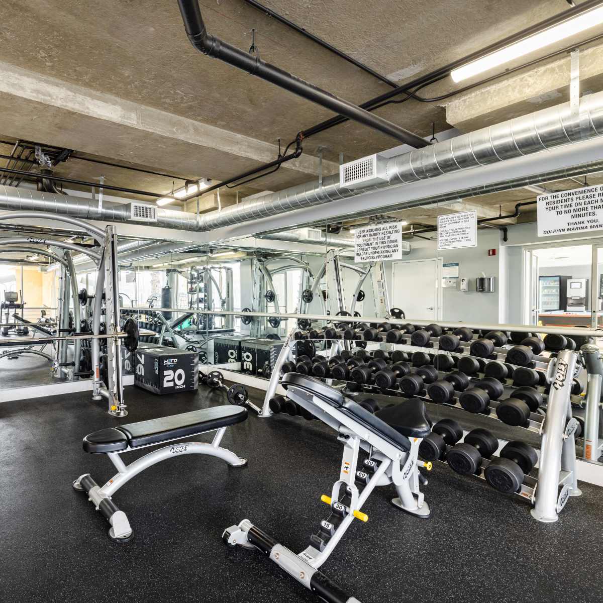 Weight bench and dumbbell rack at St Tropez Apartments in Marina Del Rey, California 