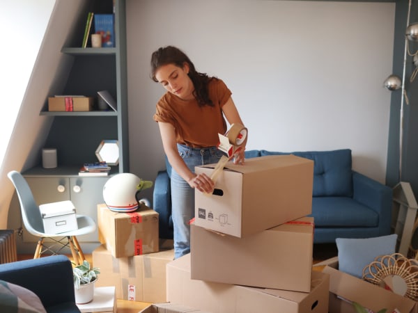 A woman packing boxes near BestBox Storage - Wentzville in Wentzville, Missouri