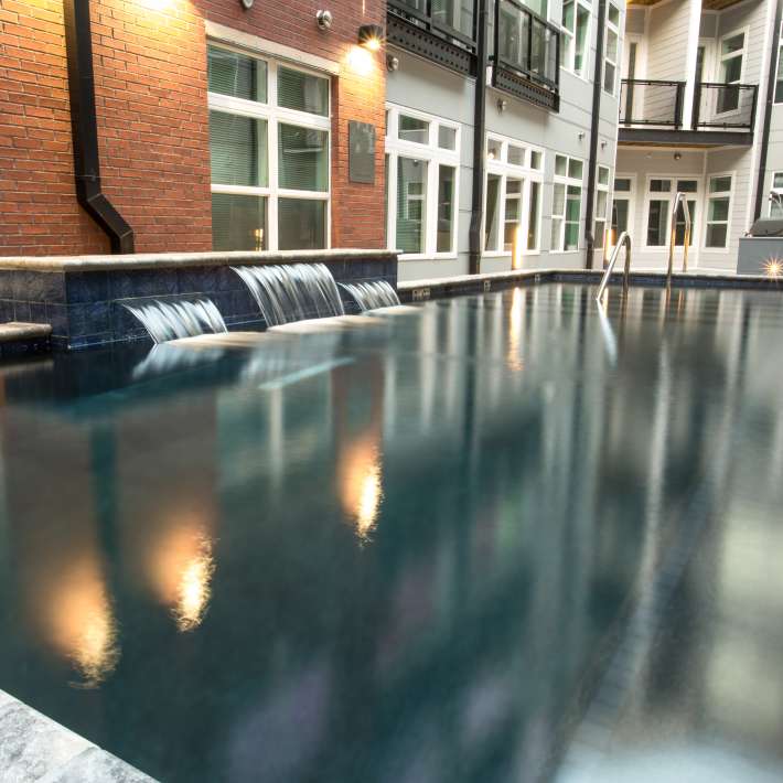 Pool with waterfalls at Attain Downtown, Norfolk, Virginia