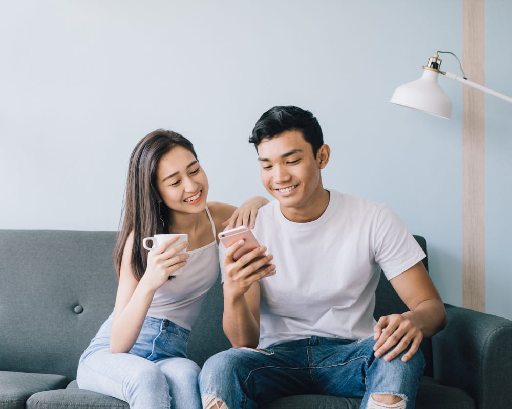 Residents connecting with us on Facebook from a mobile device in their home at Sofi Belmont Glen in Belmont, California