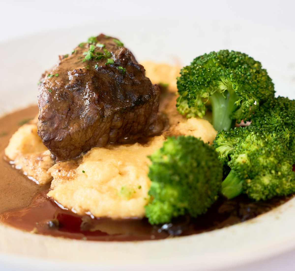 Gourmet steak meal in the dining room at The Chamberlin in Hampton, Virginia