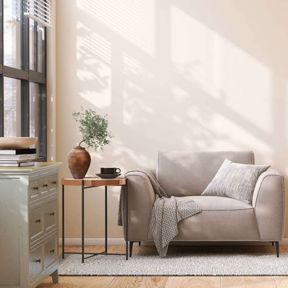 Well-lit living room with a couch, table at South Oak Villas in Garrett, Indiana