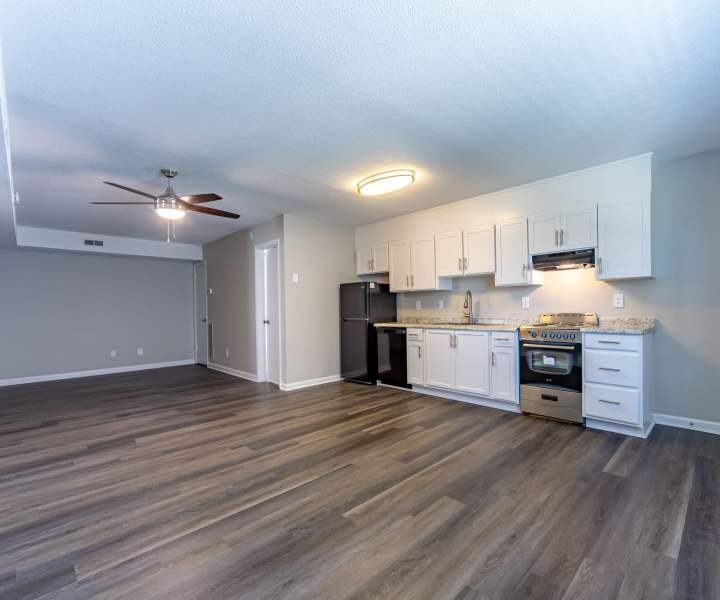 Open layout kitchen with refrigerator at Ramsey Pines in Fayetteville, North Carolina