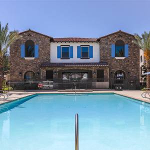 Resort-style swimming pool at The Courtyards Pacific Village in San Diego, California
