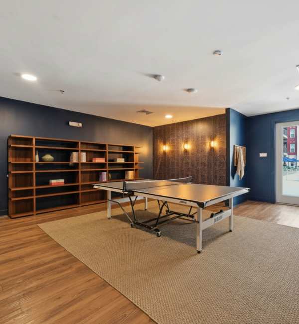 Game room near pool at The Rise at Regency in Henrico, Virginia