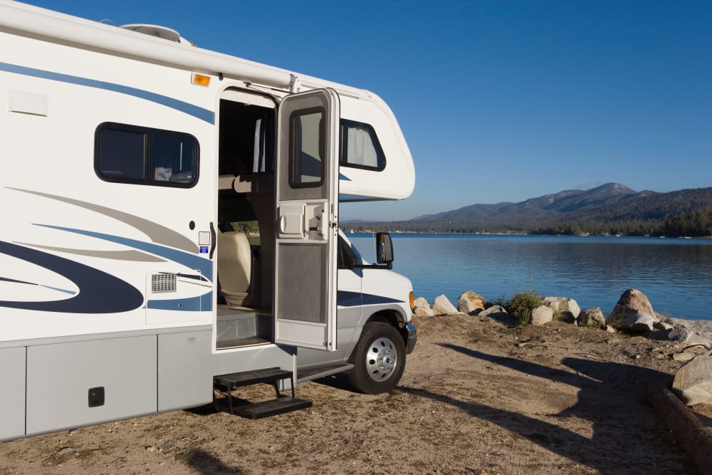 An RV parked in front of a lake near Trojan Storage of Sorrento Valley in San Diego, California