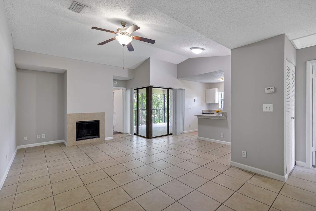 Spacious living area with fireplace at Stella Boca Raton Apartments, Boca Raton, Florida