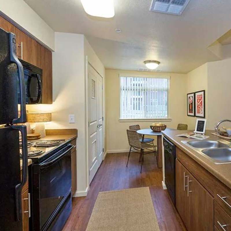 Kitchen with black appliances at Copper Mountain in Richland, Washington