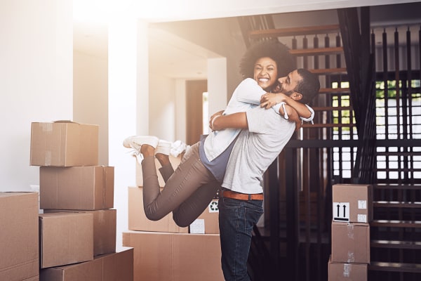 Couple unpacking moving boxes near Trojan Storage in Salem, Oregon