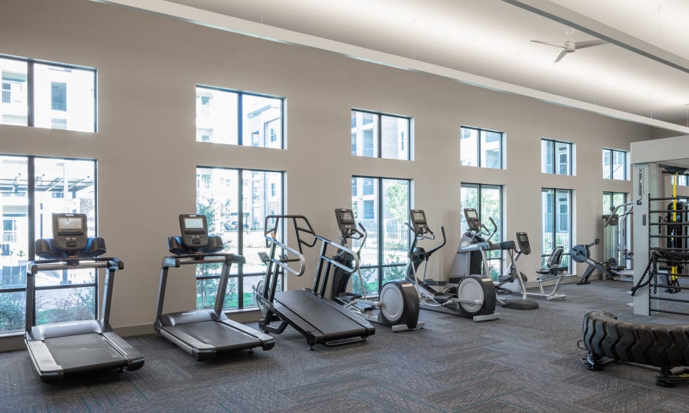 Fitness center with cardio equipment at Bellrock La Frontera in Austin, Texas