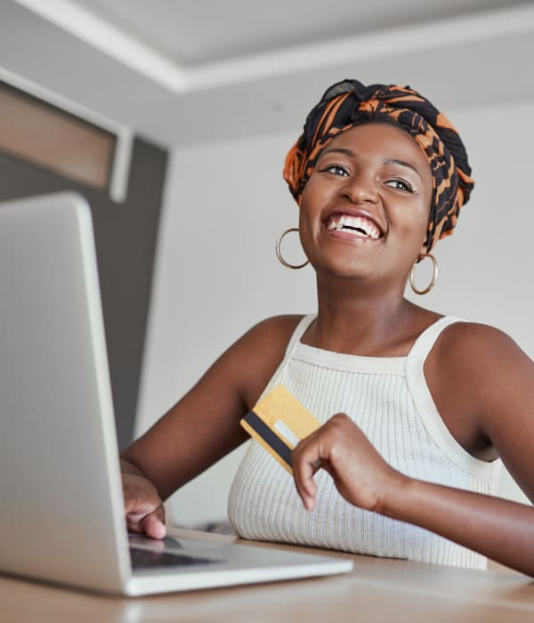 A customer paying her bill online near Key Storage - Huebner in San Antonio, Texas