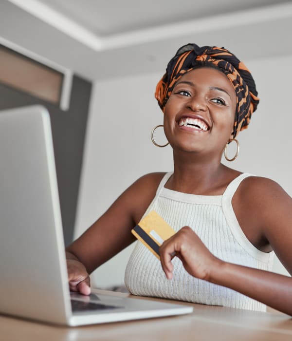 A customer paying her bill online near A-AAAKey - Semoran in Orlando, Florida