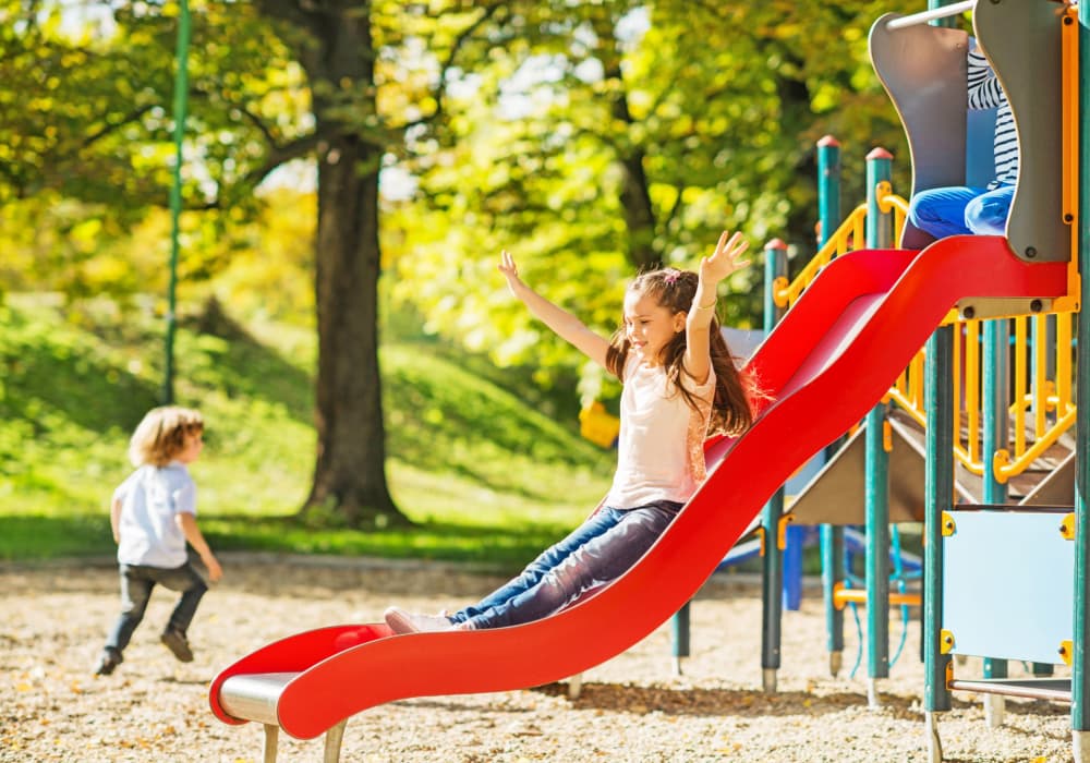 Children having fun at the children playground at North Bay Landing in Panama City, Florida 