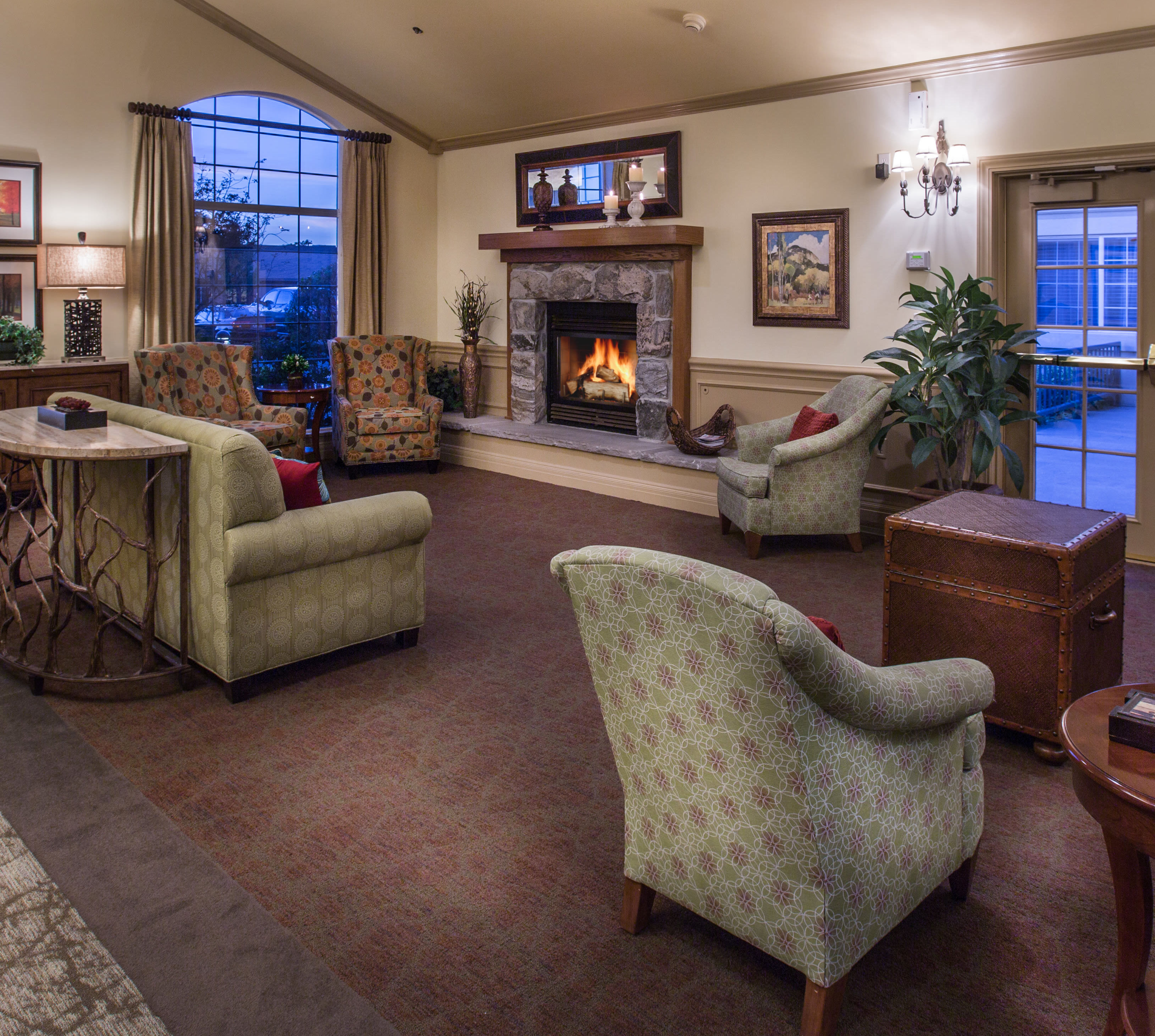 Spacious living area with fireplace at Chancellor Gardens in Clearfield, Utah