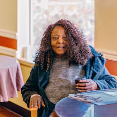 Memory care resident in an activity class at 6th Ave Senior Living in Tacoma, Washington