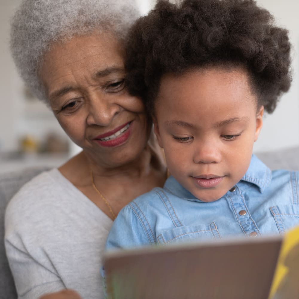 Resident and grandchild at Inspired Living Delray Beach in Delray Beach, Florida