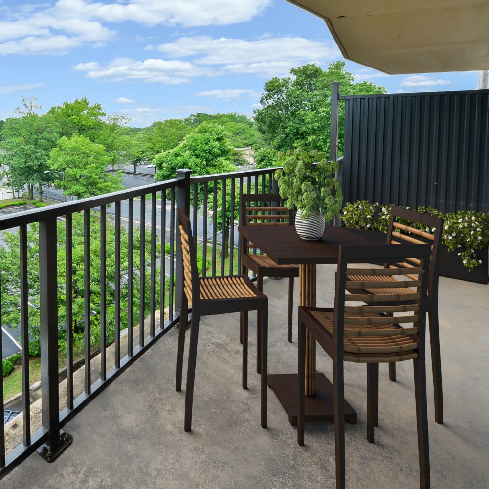 Staged balcony overlooking green space at Lexington House Apartment Homes in Cherry Hill, New Jersey
