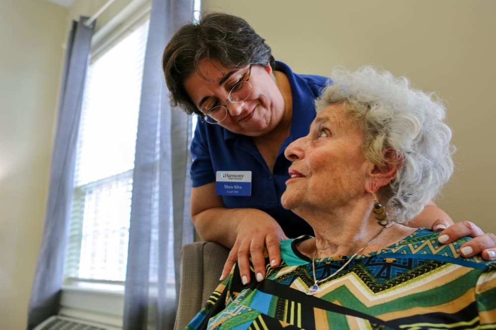 Staff helping resident at Harmony at Elkhart in Elkhart, Indiana