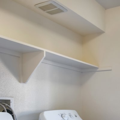 Storage shelving in the laundry area of a home at Santo Terrace in San Diego, California