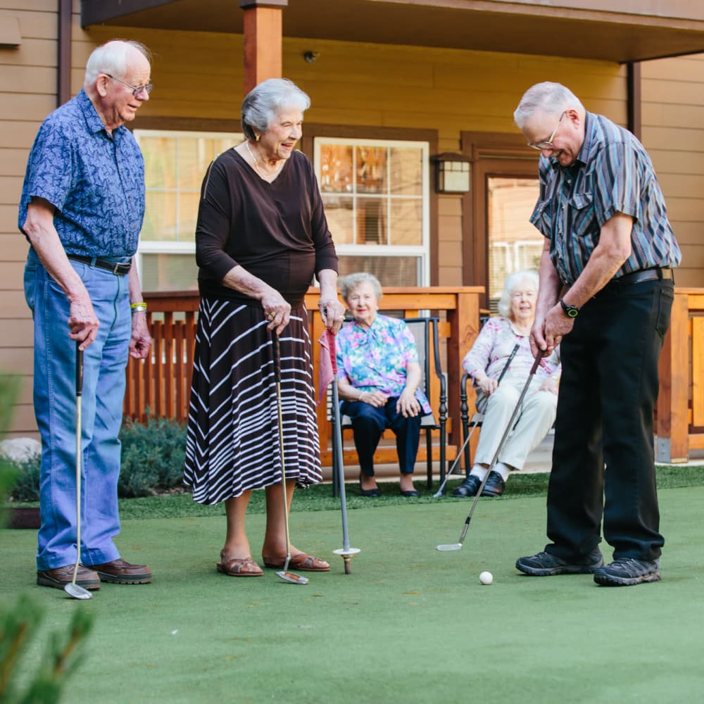 Residents playing mini golf at The Springs at Happy Valley in Happy Valley, Oregon