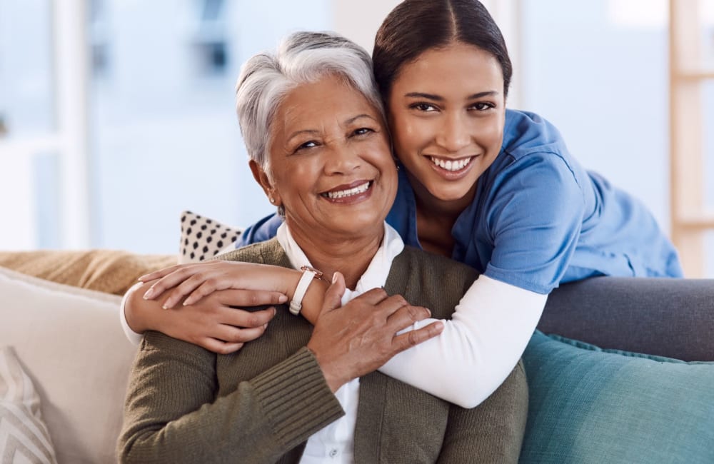 Resident and her favorite employee posing for a photo together at Leisure Manor Apartments in Sacramento, California