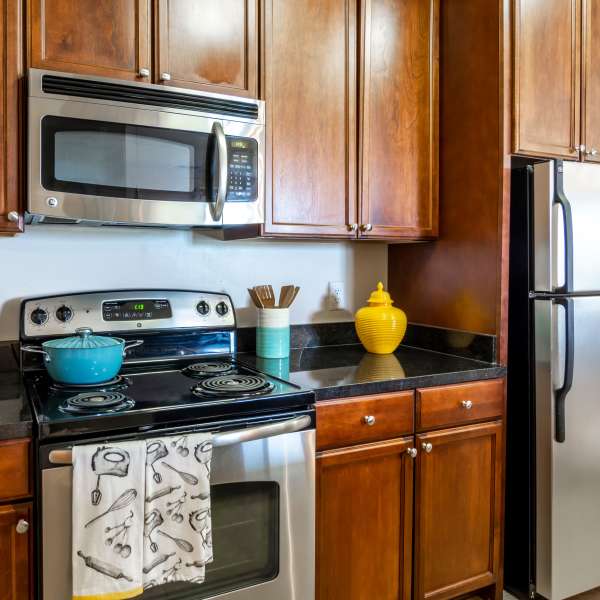 Kitchen with granite counter tops and stainless-steel appliances at The Carlton at Greenbrier, Chesapeake, Virginia