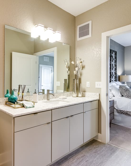 Bathroom with a large mirror and ample counter space at Steele Creek in Jacksonville, Florida
