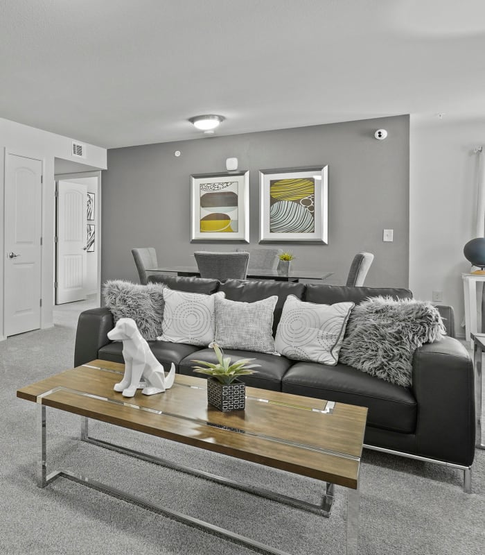 Carpeted living room at Scissortail Crossing Apartments in Broken Arrow, Oklahoma